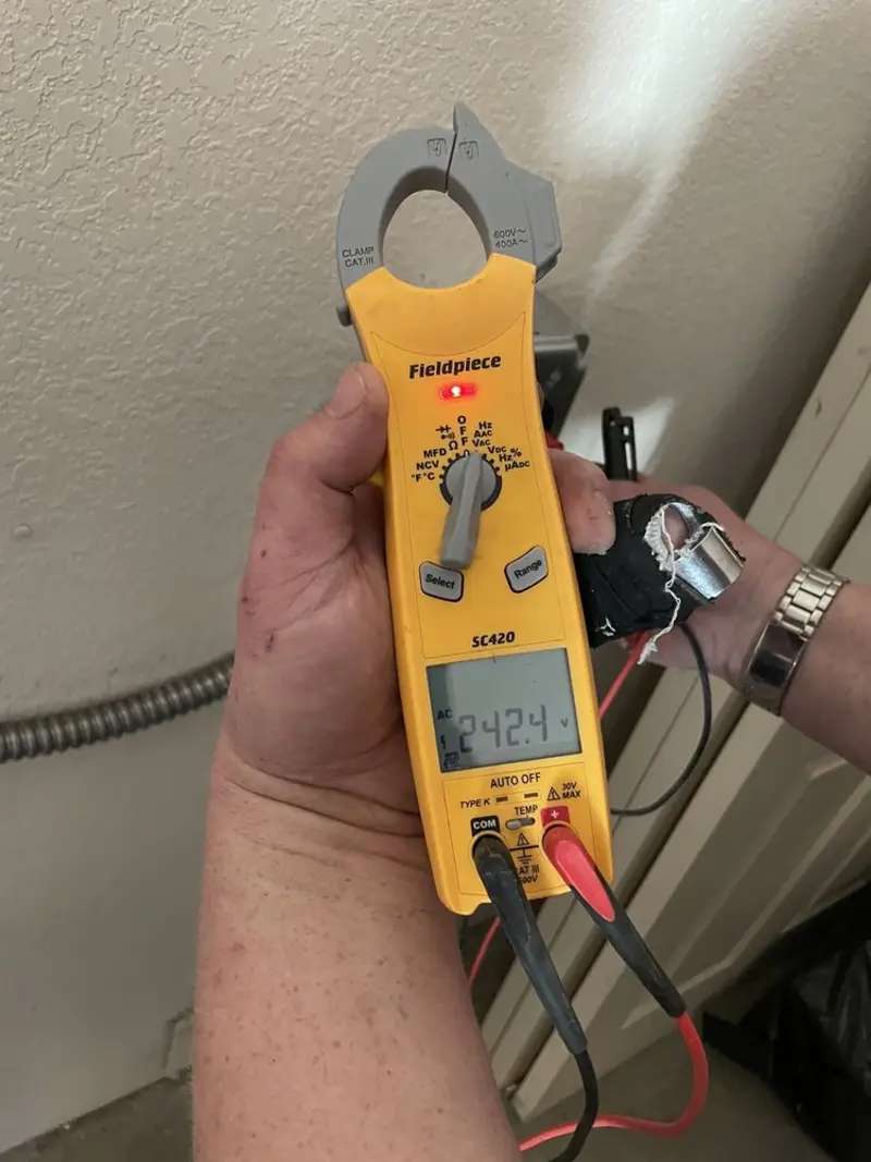 Voltage testing with clamp meter during Recessed Lighting Installation in Avery Creek
